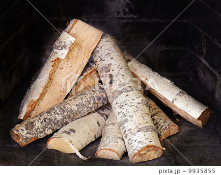 Fireplace with birch wood. Fireplace with birch wood. 9935855
