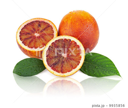 Ripe red blood oranges with cut and green leaves isolated on whi 9935856