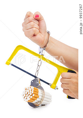 Addiction concept with cigarettes and handcuffs 9937267
