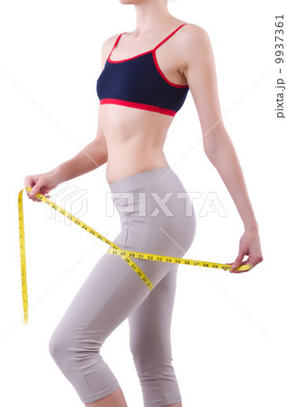 Young girl with centimeter in dieting concept Young girl with centimeter in dieting concept 9937361