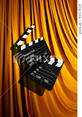 Movie clapper board against curtain Movie clapper board against curtain 9937639