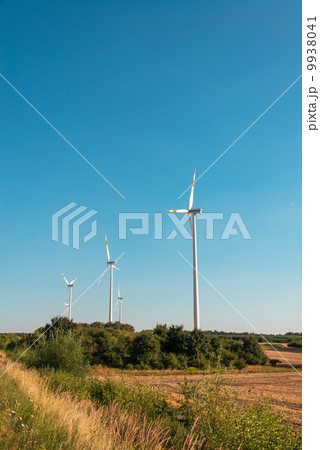 Wind mills during bright summer day Wind mills during bright summer day 9938041