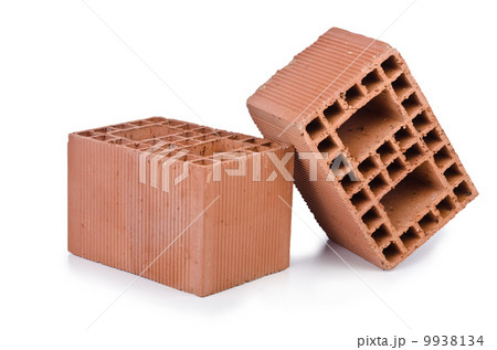 Stack of clay bricks isolated on white 9938134