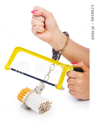 Addiction concept with cigarettes and handcuffs 9938623