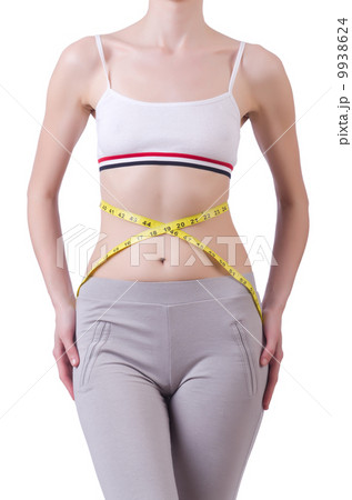 Young girl with centimeter in dieting concept 9938624