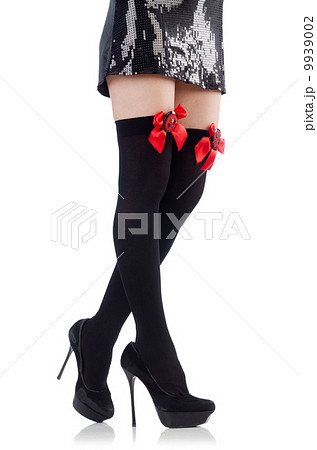 Woman legs with stockings on white 9939002