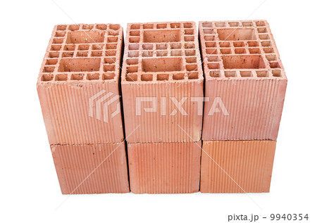 Stack of clay bricks isolated on white Stack of clay bricks isolated on white 9940354