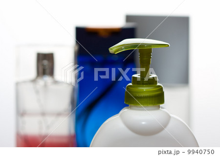 Body lotion on perfume bottles of background 9940750