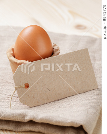 brown egg in handmade holder brown egg in handmade holder 9941779