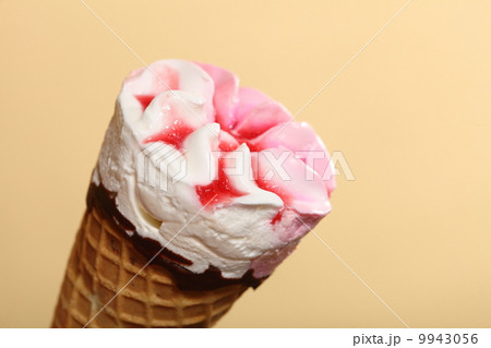 Berry icecream waffle cone on orange 9943056
