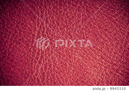 Red textured leather grunge background closeup 9943310