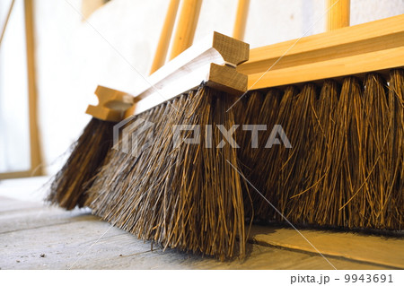 large brooms on wooden floor housework large brooms on wooden floor housework 9943691