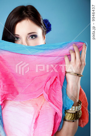 woman hides her face with shawl woman hides her face with shawl 9946437