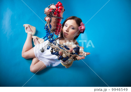 summer girl plenty of jewellery beads in hands 9946549