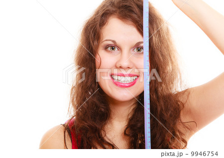 Happy sport fitness woman girl with measure tape isolated. Diet. Happy sport fitness woman girl with measure tape isolated. Diet. 9946754