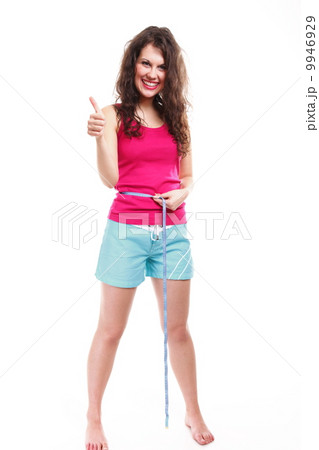 sporty fit woman with measure tape thumbs up sporty fit woman with measure tape thumbs up 9946929