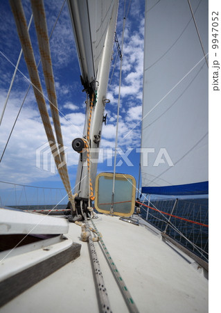 Sailboat yacht sailing in blue sea. Tourism Sailboat yacht sailing in blue sea. Tourism 9947052
