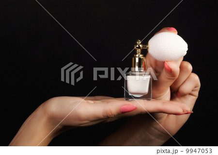 female hand with perfume bottle female hand with perfume bottle 9947053