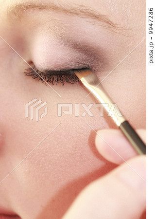Part of face female eye makeup applying with brush 9947286