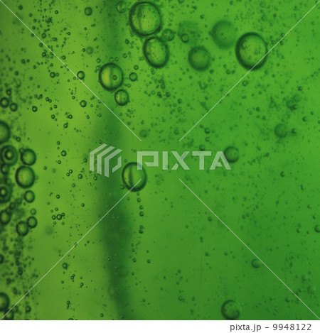 soap bubbles green liquid background 9948122
