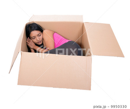 girl sleeping in a cardboard box 9950330