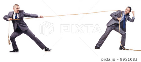 Man in tug of war concept on white Man in tug of war concept on white 9951083