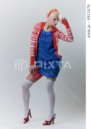 emotion pose blond girl in red woolly 9951676
