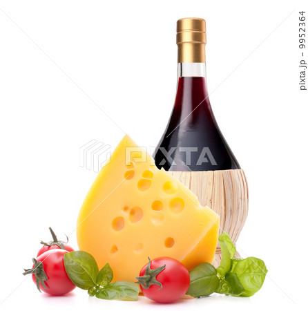 Red wine bottle, cheese and tomato still life 9952364