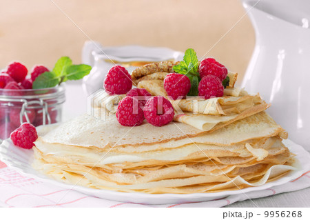 Homemade pancakes with raspberries and mint Homemade pancakes with raspberries and mint 9956268