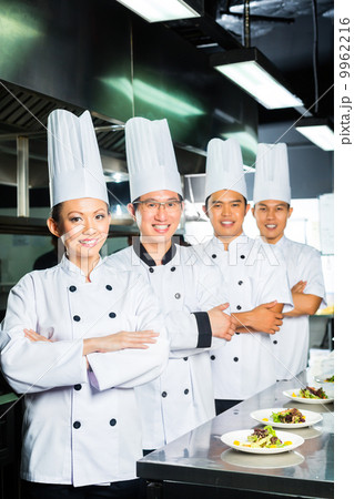 Asian Chef in restaurant kitchen cooking Asian Chef in restaurant kitchen cooking 9962216