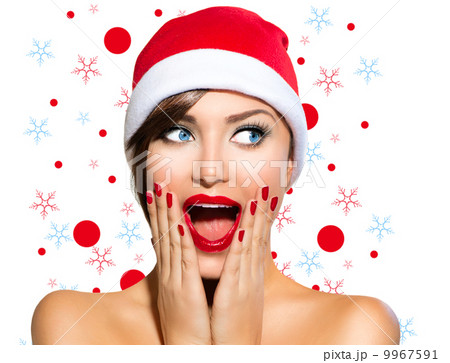 Christmas Woman. Beauty Model Girl in Santa Hat 9967591
