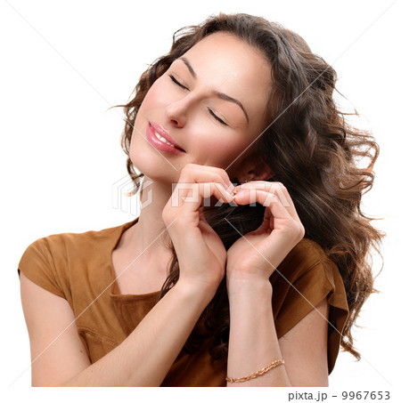 Woman in love showing Heart with her Hands. St. Valentine's Day 9967653