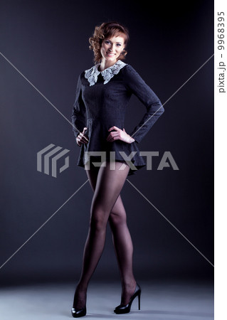 Smiling middle-aged model in blouse with collar Smiling middle-aged model in blouse with collar 9968395