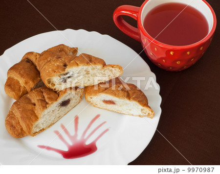 Tasty croissants and fruit tea Tasty croissants and fruit tea 9970987