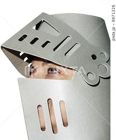 Woman with knight's helmet on the head Woman with knight's helmet on the head 9971326