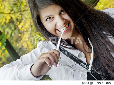 Young smiling teenage girl with sunglasses Young smiling teenage girl with sunglasses 9971369