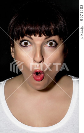 Young woman making surprised face Young woman making surprised face 9971382