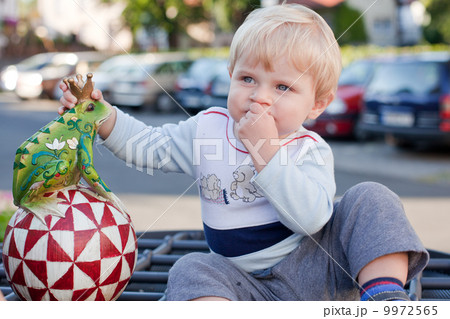 Little toddler boy with handmade toy frog Little toddler boy with handmade toy frog 9972565