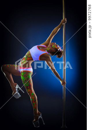Passionate slim woman dancing with pylon Passionate slim woman dancing with pylon 9972768