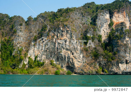 Karst limestone structure of tropical island with forest 9972847