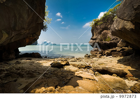 Tropical beach view from karst limestone cave 9972873