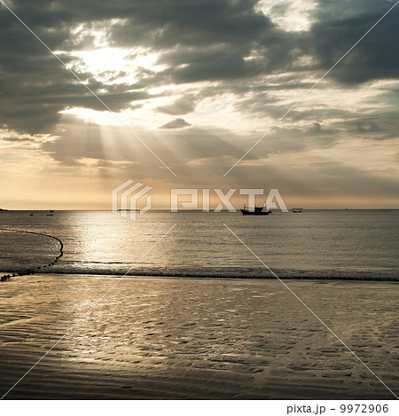 Golden colors of sunset at tropical sandy beach. Thailand 9972906