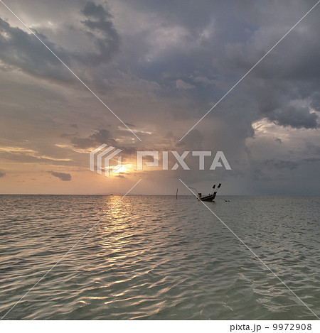 Sunset at tropical beach with fishing boat. Thailand Sunset at tropical beach with fishing boat. Thailand 9972908