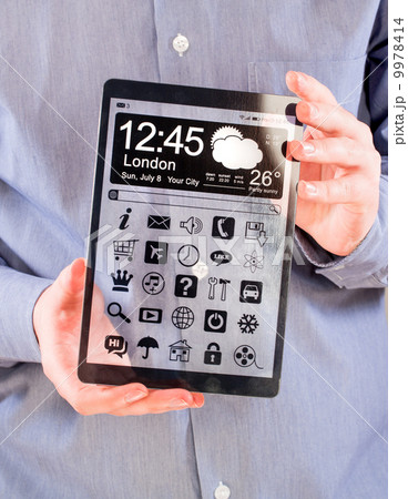 Tablet with transparent screen in human hands. 9978414