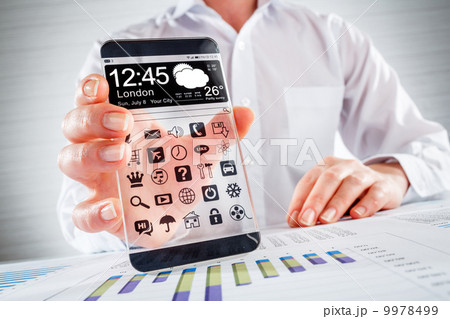 Smartphone with transparent screen in human hands. 9978499