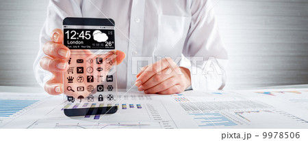 Smartphone with transparent screen in human hands. Smartphone with transparent screen in human hands. 9978506