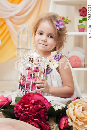 Portrait of lovely girl posing with flowers 9980235