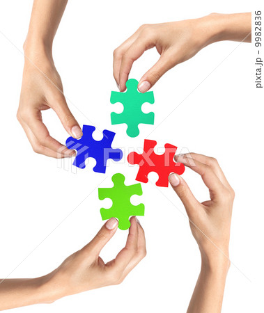 Red and blue puzzle in woman hands isolated on white 9982836