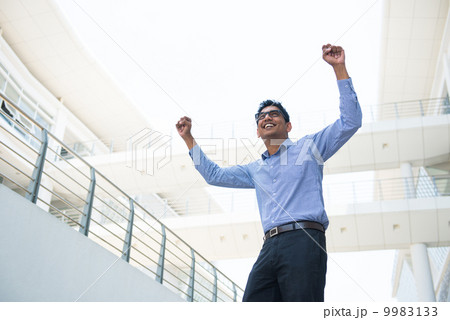 indian business male celebrating success with office background indian business male celebrating success with office background 9983133