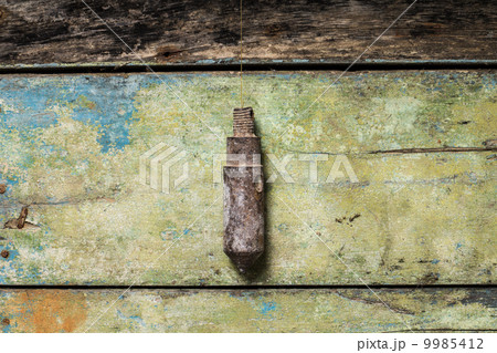Old Building Tool Plummet on Wood background Old Building Tool Plummet on Wood background 9985412